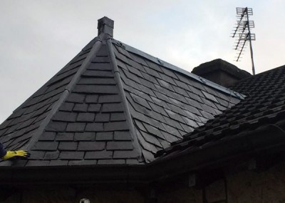 Slated dormer replaced with grey Marley plain tiles.